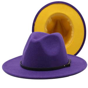 Detail view of the purple and yellow wool fedora hat with a black leather buckle belt