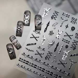 Gothic 3D embossed nail stickers featuring dark rabbits and safety pins on gray nails