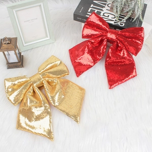 Sparkly red and gold sequin Christmas bows for festive holiday tree decoration