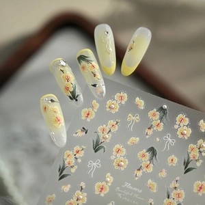 3D floral nail stickers with yellow flowers and white bows on transparent film