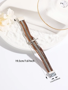 Detailed view of multilayer leather bracelet with Blessed cross charm and size labels