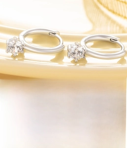 Detailed view of silver hoop earrings featuring 10mm inner diameter and zircon stones