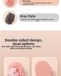 Detailed view of dual-sided pink and grey bath mitts showing scrub texture and sponge mesh