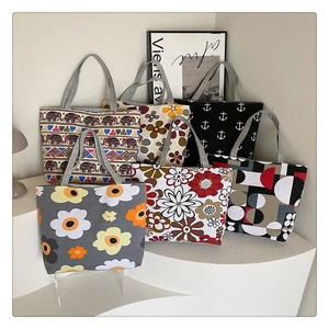 Detailed display of large canvas tote bags with various floral and ethnic prints