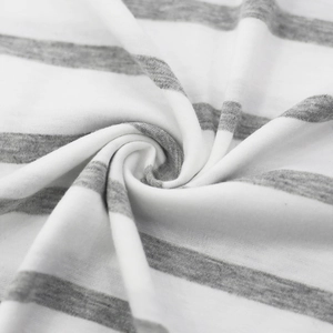 Close-up of grey and white striped knit fabric showing soft texture and premium drape