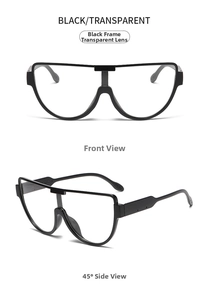 Detail view of large black frame glasses with transparent lenses and thick temples
