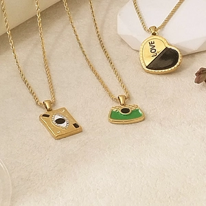 Elegant 18K gold-plated stainless steel necklaces with heart, bag, and eye charms