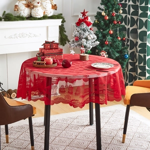 Detail of red Christmas lace tablecloth with snowflake patterns in a cozy festive room