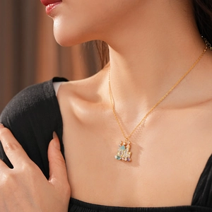 Model wearing a gold-plated castle necklace set with colorful zircon stones