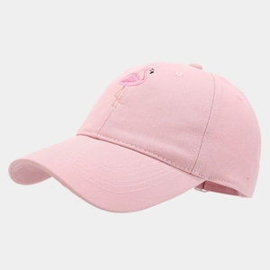 Close-up of pink cotton baseball cap with flamingo embroidery and twill texture