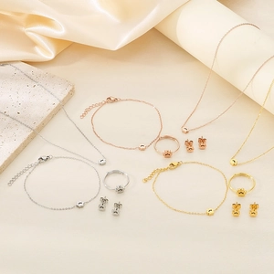 Cute stainless steel pet paw jewelry set in gold, rose gold, and silver colors