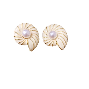 Vintage shell-shaped enamel earrings with pearl center and golden edges on white background