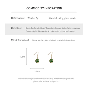 Detailed size and weight specs for green bead tassel earrings in alloy and glass