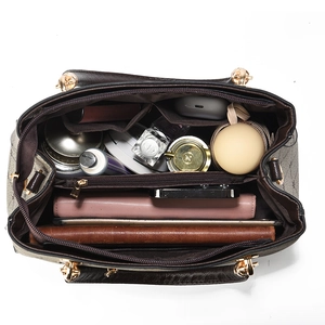 Spacious interior of dark brown leather handbag showing large storage capacity