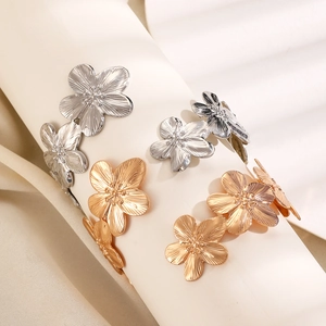 Floral upper arm cuff bracelet in gold and silver finish with detailed textured design