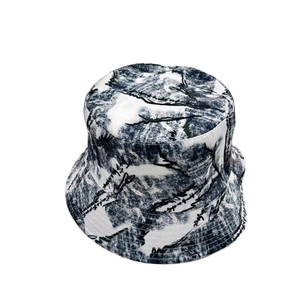 Detail of artistic script lettering on double-sided ink graffiti bucket hat surface