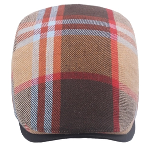 Detailed view of the classic brown and red plaid pattern on the adjustable flat cap fabric