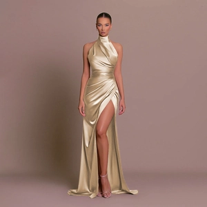 Detail of the high-slit champagne gold satin evening dress with elegant waist pleats