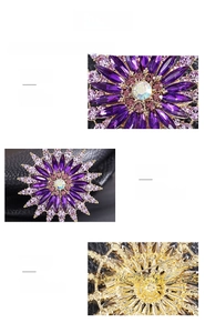 Detailed macro view of purple crystal flower brooch with gold-plated pin and safety clasp