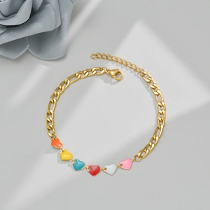 Gold plated Figaro chain bracelet featuring colorful enamel heart charms and adjustable clasp