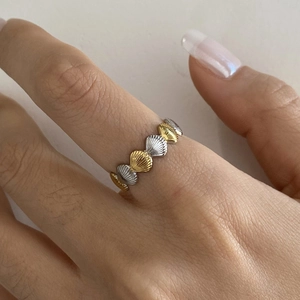 Two-tone 18k gold plated stainless steel shell ring featuring a continuous textured design