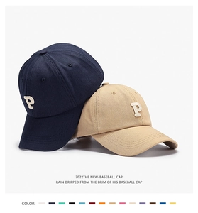 Detailed close-up of soft top baseball caps with P letter embroidery and color options