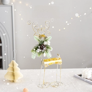 Golden and white iron wire Christmas reindeer tabletop ornament with pine cone and berries