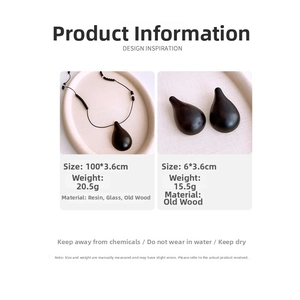 Detail of resin wood teardrop pendant necklace and earrings set with sizing specs