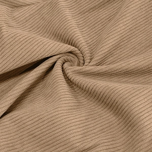 Close-up of thick brown corduroy fabric texture with vertical stripes for casual men's pants