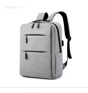 Detail view of grey business laptop backpack with side USB port and durable fabric