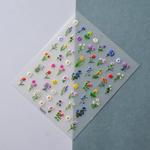 Detailed view of 5D floral nail stickers with intricate daisy and lavender relief patterns