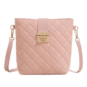 Pink quilted leather bucket crossbody bag with gold square buckle and fine chain strap