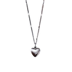 Elegant silver heart pendant necklace with delicate chain on a minimalist white background