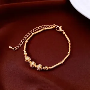 18K gold plated bamboo link bracelet with sparkling hollow beads on velvet background