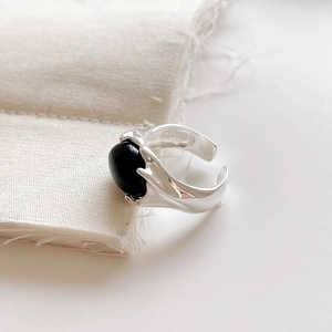 Macro shot of S925 sterling silver ring with black agate and engraved S925 hallmark