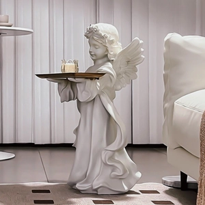 White resin angel floor sculpture with golden storage tray for home decor