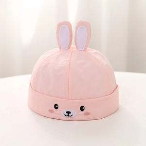 Detailed embroidery of cartoon animal face on pink cotton baby brimless hat with 3D ears