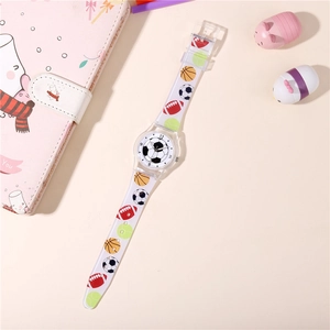 Detailed view of kids quartz watch with soccer dial and clear sports patterned strap