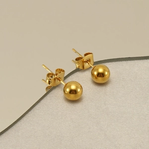 Polished gold stainless steel ball stud earrings with classic push-back butterfly closures