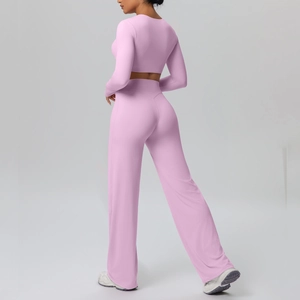 Detail view of pink long-sleeve crop top and high-waist wide-leg pants from the back