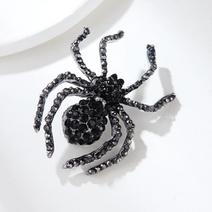 Detailed macro view of vintage black crystal spider brooch with sparkling rhinestones