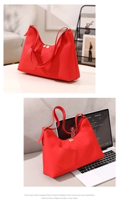 Detail of red water ripple embossed PU leather crossbody bag with front pocket