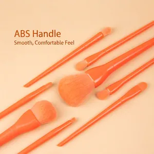Set of 8 orange makeup brushes with ergonomic ABS handles and soft synthetic bristles