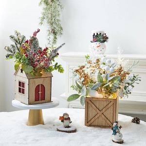 Lighted mini Christmas tree in wooden box desk decor with artificial floral arrangements