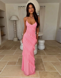 Detail of pink backless dress showing ruffles and side slit on lightweight fabric