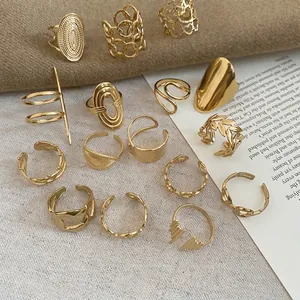 Golden stainless steel ring set featuring hollow heart and minimalist geometric designs