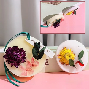 Floral scented wax tablets with dried flowers and green ribbon for home fragrance decor