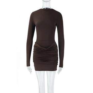 Detailed view of dark brown ruched bodycon dress with long sleeves and pleated texture