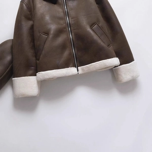 Minimalist dark brown faux leather jacket with white faux shearling cuffs and hem detail