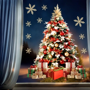 Detailed Christmas window stickers showing golden snowflakes and a tree on glass